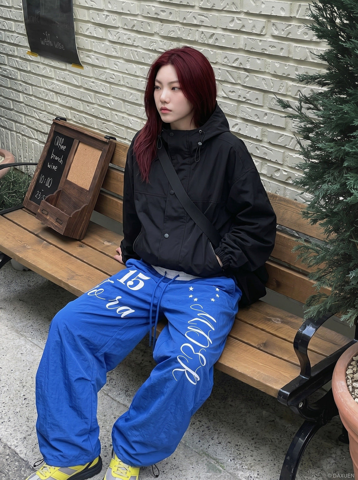 DAXUEN Oversized wide-leg track pants with graphic prints — model photo