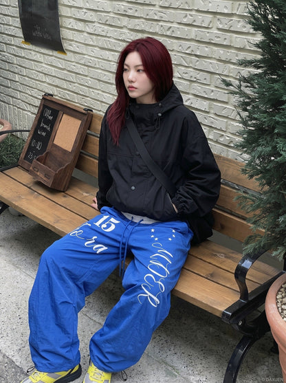 DAXUEN Oversized wide-leg track pants with graphic prints — model photo