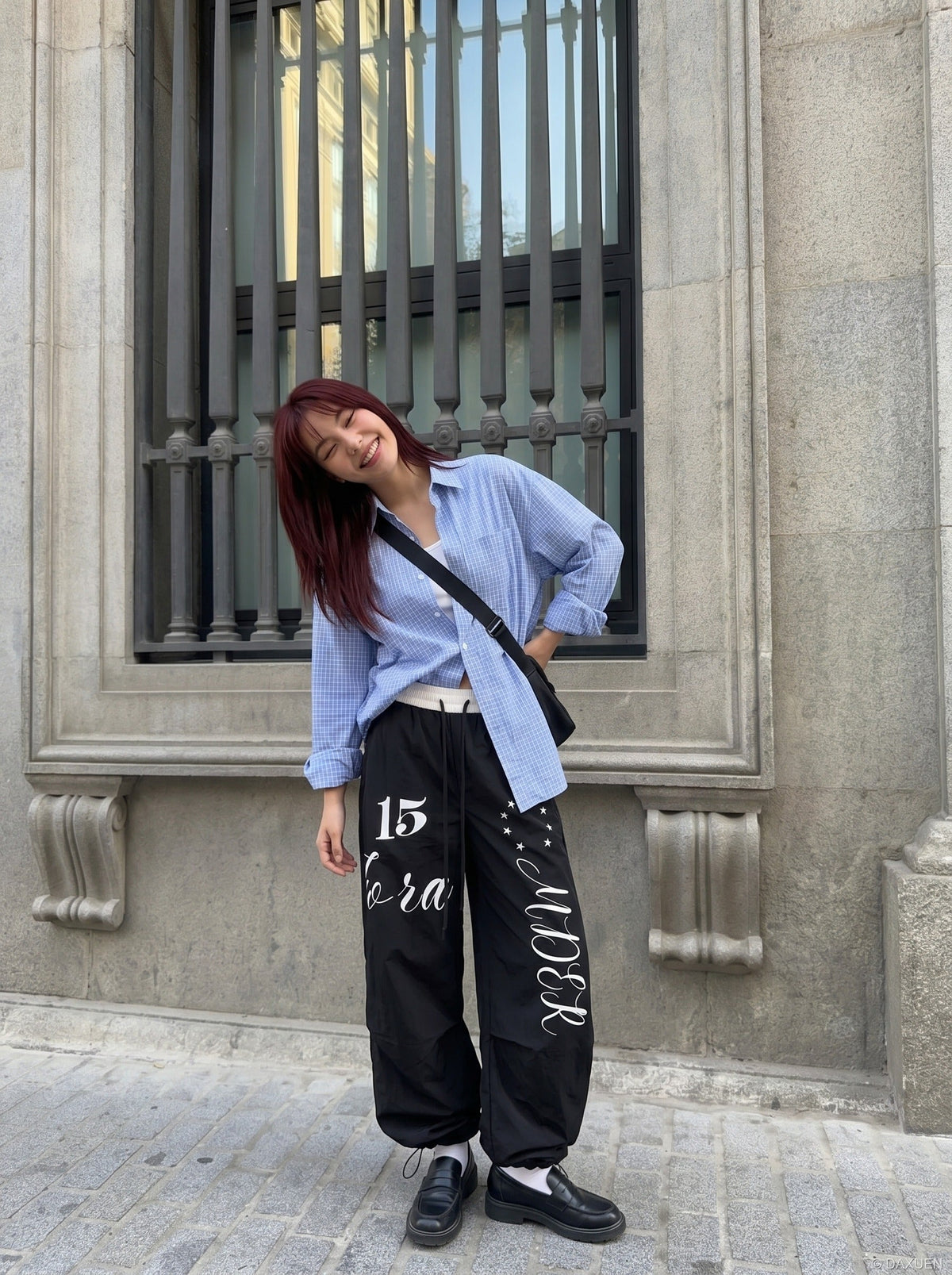 DAXUEN Oversized wide-leg track pants with graphic prints — model photo