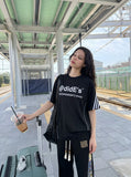 DAXUEN Black short-sleeved t-shirt with graphic print — model photo