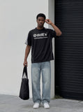 DAXUEN Black short-sleeved t-shirt with graphic print — model photo