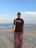 DAXUEN Black short-sleeved t-shirt with graphic print — model photo