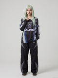DAXUEN Black long-sleeved oversized jersey top with graphic prints — model photo