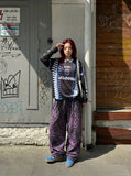 DAXUEN Black long-sleeved oversized jersey top with graphic prints — model photo