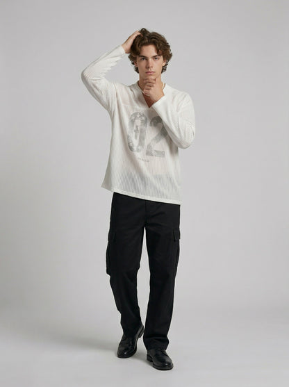 DAXUEN Long-sleeved top with graphic prints and ribbed texture — model photo