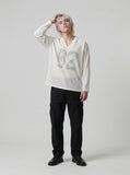 DAXUEN Long-sleeved top with graphic prints and ribbed texture — model photo