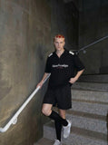 DAXUEN Oversized short-sleeved polo shirt with graphic print — model photo