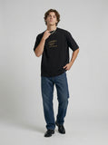 DAXUEN Bold oversized t-shirt with graphic embroidery and studs — model photo