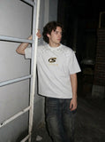 DAXUEN Bold oversized t-shirt with graphic embroidery and studs — model photo