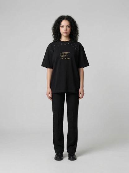 DAXUEN Bold oversized t-shirt with graphic embroidery and studs — model photo
