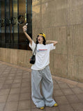 DAXUEN Bold graphic oversized t-shirt in black and white — model photo