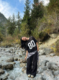 DAXUEN Oversized short-sleeved mesh jersey top — model photo