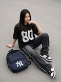 DAXUEN Oversized short-sleeved mesh jersey top — model photo