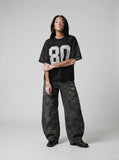 DAXUEN Oversized short-sleeved mesh jersey top — model photo