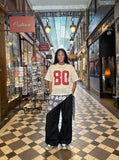 DAXUEN Oversized short-sleeved mesh jersey top — model photo