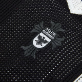 DAXUEN black knit polo with bold '7' graphic