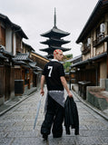 DAXUEN black knit polo with bold '7' graphic — model photo