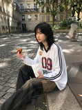 DAXUEN white oversized plaid '09' graphic v-neck jersey top — model photo