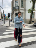 DAXUEN black oversized bold-red-side-panel sweatpants — model photo