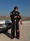 DAXUEN black oversized bold-red-side-panel sweatpants — model photo