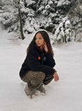 DAXUEN black oversized hooded jacket with red star patch — model photo