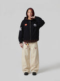 DAXUEN black oversized hooded jacket with red star patch — model photo