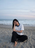 DAXUEN white athletic top with running club graphic — model photo
