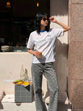 DAXUEN white athletic top with running club graphic — model photo