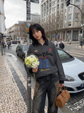 DAXUEN black oversized bold-script and distressed-denim polo shirt — model photo