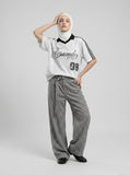 DAXUEN Short-sleeved polo shirt with vertical stripes and graphic text — model photo