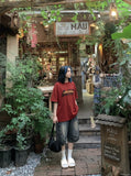 DAXUEN white oversized bold-stacked-text graphic tee — model photo
