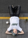 DAXUEN white oversized bold-stacked-text graphic tee — model photo