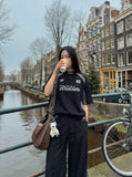 DAXUEN Oversized short-sleeved embroidered T-shirt — model photo
