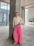 DAXUEN pink and grey striped wide-leg sweatpants — model photo
