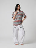 DAXUEN grey striped polo with number 23 graphic — model photo