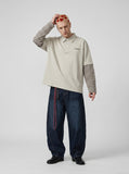 DAXUEN Oversized long sleeve polo shirt with striped sleeves — model photo