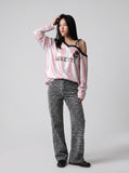 DAXUEN striped oversized long-sleeve top with 'LOKETTE' text — model photo