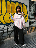 DAXUEN striped oversized long-sleeve top with 'LOKETTE' text — model photo