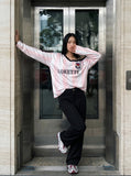 DAXUEN striped oversized long-sleeve top with 'LOKETTE' text — model photo