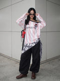 DAXUEN striped oversized long-sleeve top with 'LOKETTE' text — model photo
