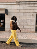 DAXUEN yellow and dark blue studded graphic wide-leg pants — model photo