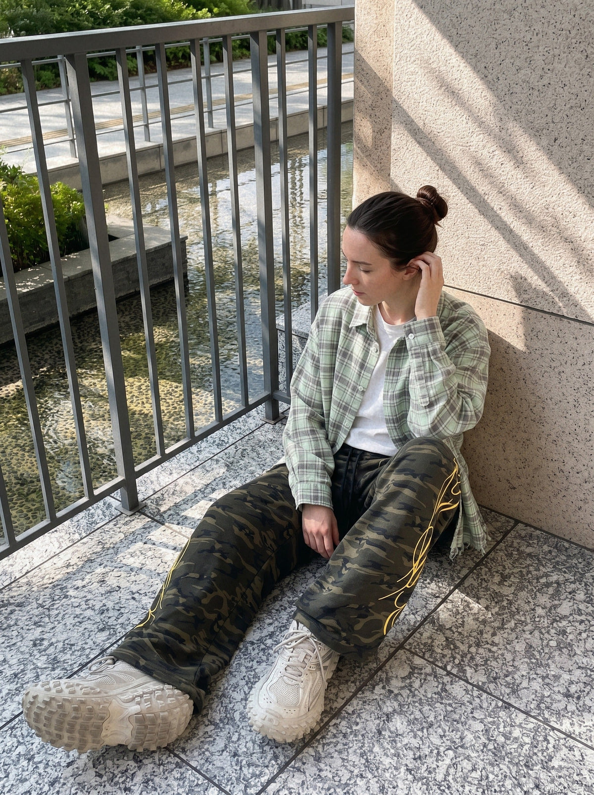 DAXUEN camouflage sweatpants with bold swirling graphics — model photo