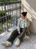 DAXUEN camouflage sweatpants with bold swirling graphics — model photo