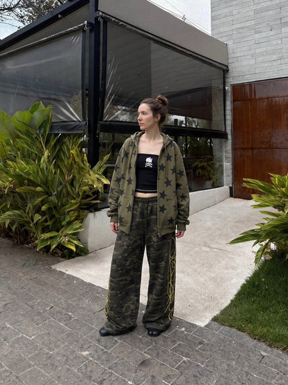 DAXUEN camouflage sweatpants with bold swirling graphics — model photo