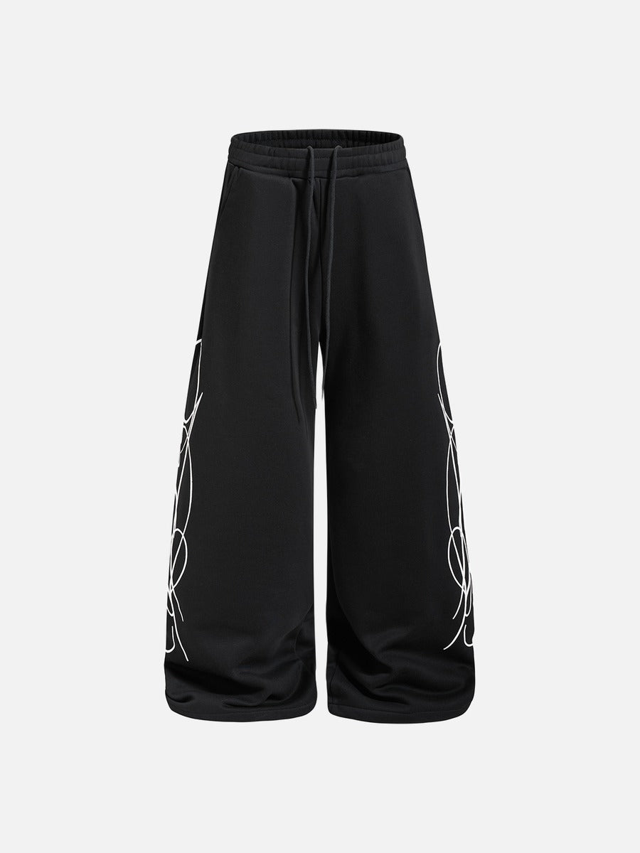 DAXUEN camouflage sweatpants with bold swirling graphics