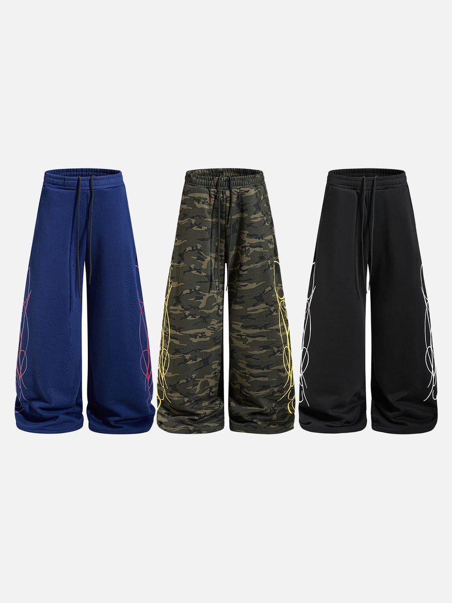 DAXUEN camouflage sweatpants with bold swirling graphics