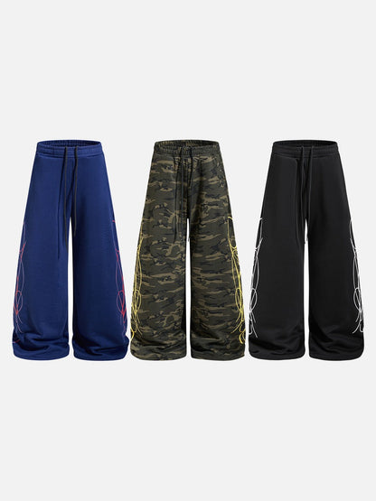 DAXUEN camouflage sweatpants with bold swirling graphics