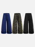 DAXUEN camouflage sweatpants with bold swirling graphics