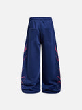 DAXUEN camouflage sweatpants with bold swirling graphics