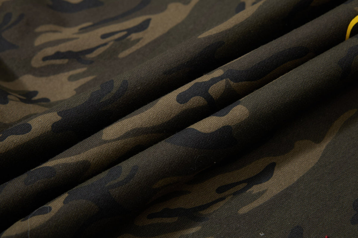 DAXUEN camouflage sweatpants with bold swirling graphics